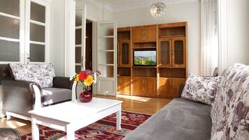 Deluxe Large 2 Bedrooms Apartment | Living area | 82-inch TV with satellite channels, DVD player