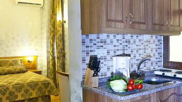 Deluxe Studio (Apartment) | Living area | 82-inch TV with satellite channels, DVD player