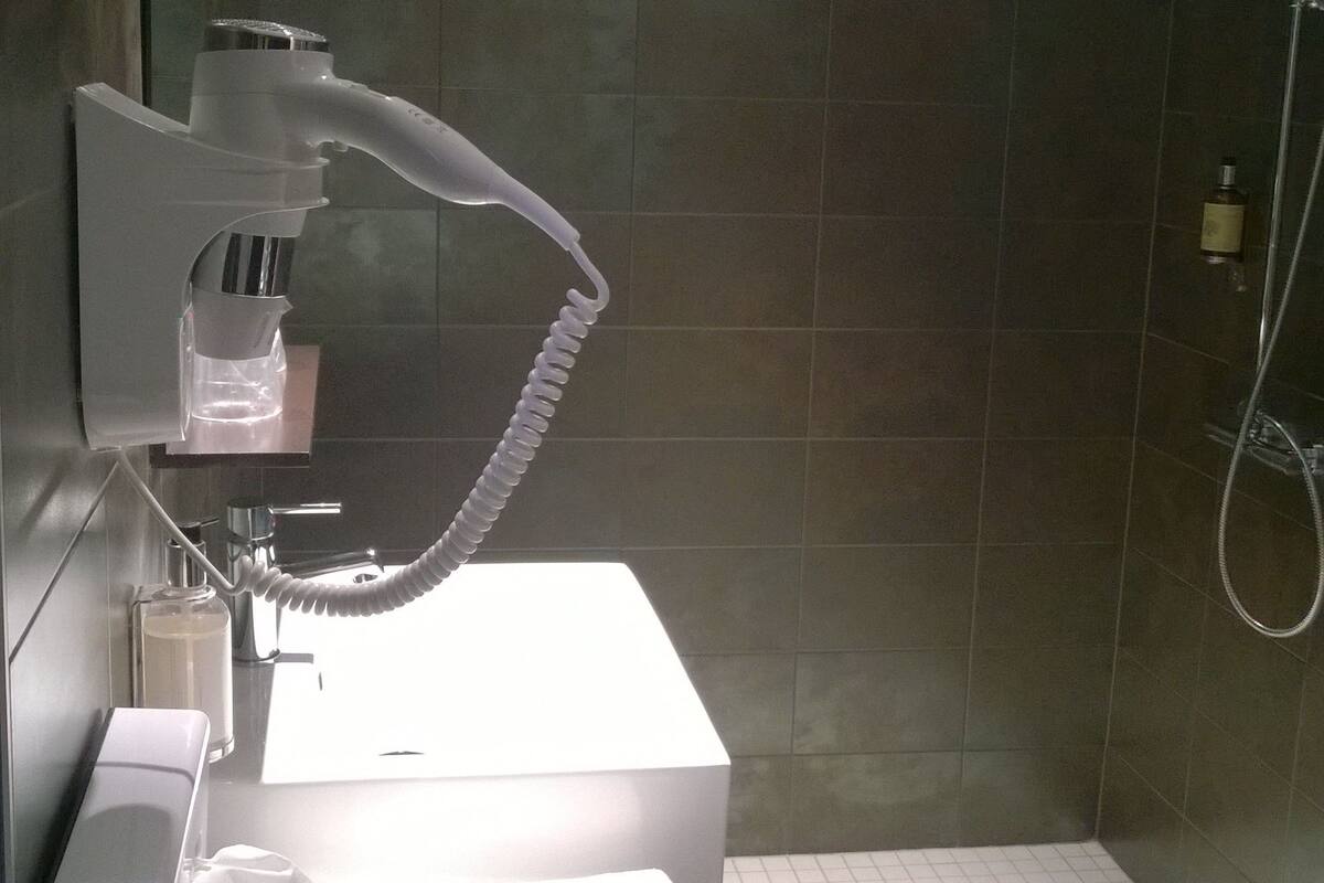 superior double room | bathroom | shower, free toiletries, hair dryer, towels