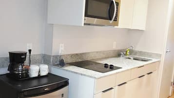 Fridge, microwave, stovetop, coffee/tea maker