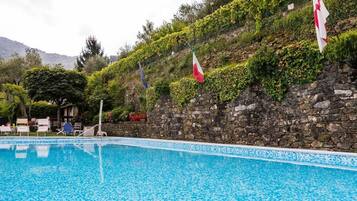 Seasonal outdoor pool, pool umbrellas, sun loungers