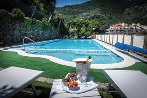 Seasonal outdoor pool, pool umbrellas, pool loungers