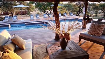 Outdoor pool, pool umbrellas, sun loungers