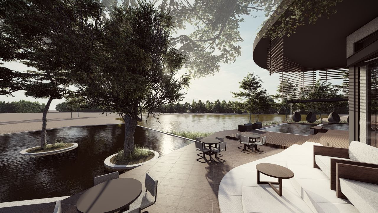 An outdoor patio area with seating and a water feature.