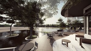 An outdoor patio area with seating and a water feature. - Tshukudu Game Lodge (Hoedspruit)