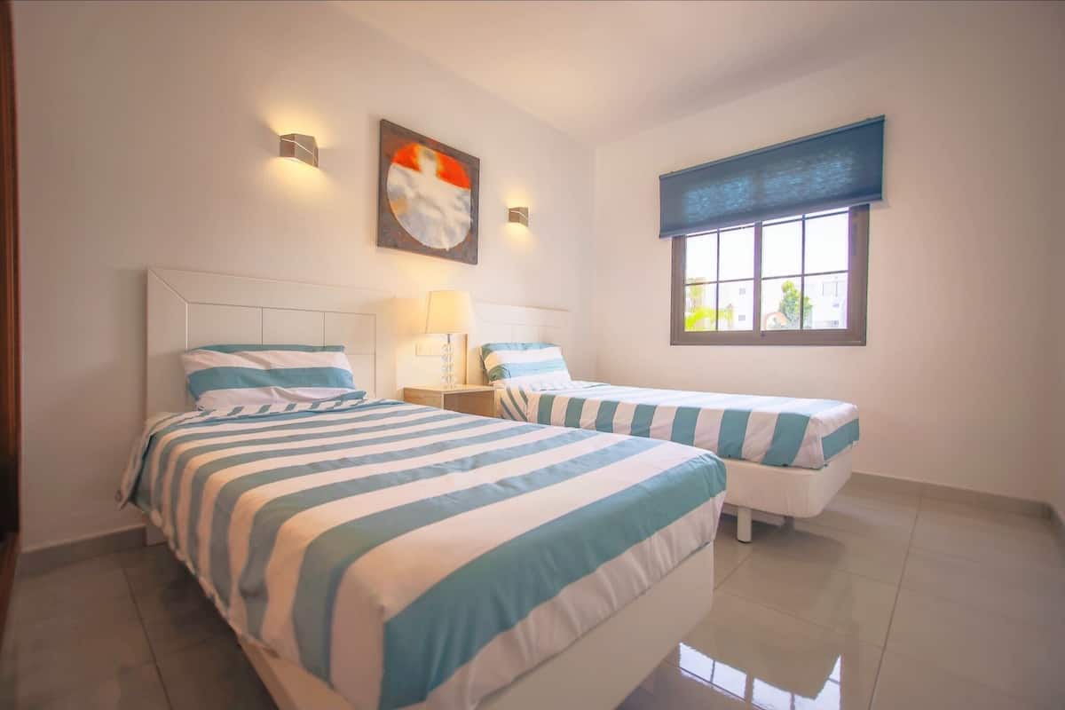 1 bedroom, blackout drapes, iron/ironing board, cribs (free)