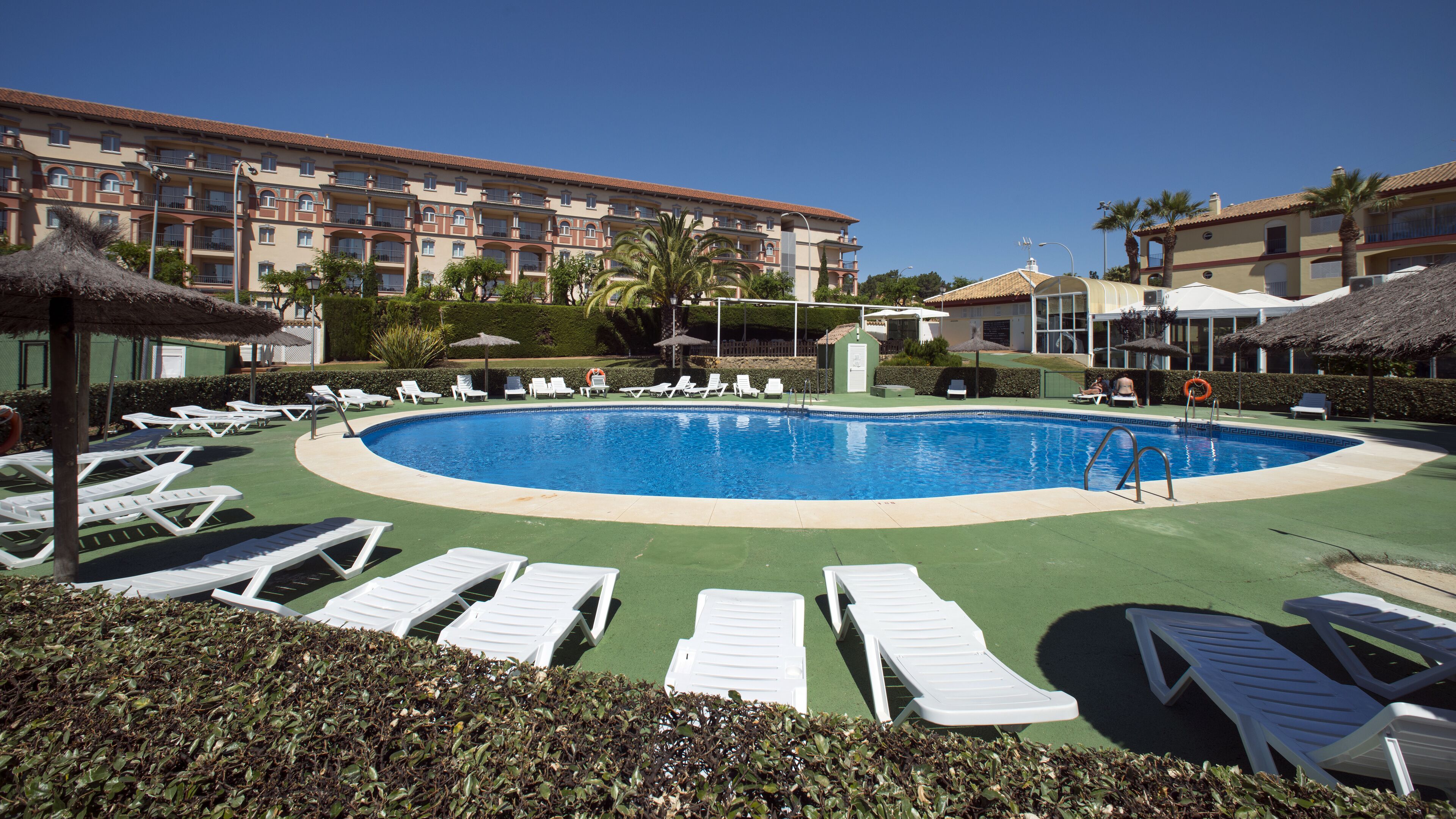 Seasonal outdoor pool, pool umbrellas, pool loungers