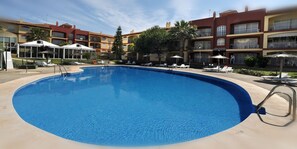 Seasonal outdoor pool, pool umbrellas, pool loungers