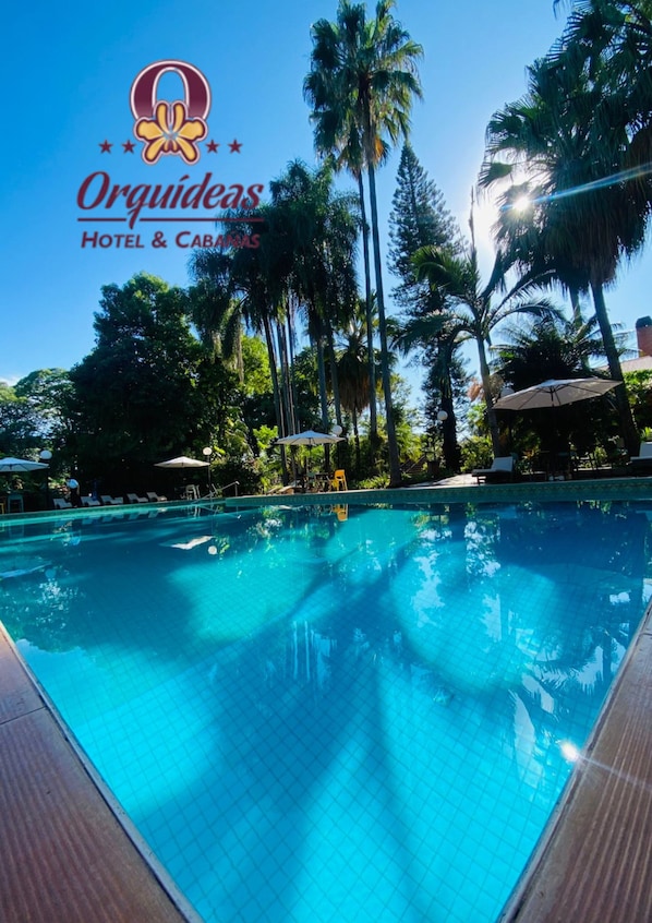 Outdoor pool, open 8:00 AM to 9:00 PM, pool umbrellas, pool loungers