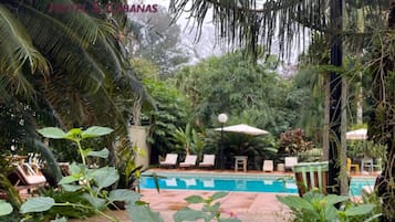 Outdoor pool, open 8:00 AM to 9:00 PM, pool umbrellas, pool loungers