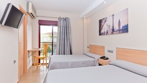 A hotel room with two beds, a desk, a chair, a TV, and a painting of a cityscape. - Hotel Olympia Ronda I (Puig)