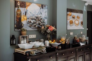 A dining area with a buffet setup, including a variety of food items and decorative elements. - Les Demeures de Varennes, BW Signature Collection (Varennes-Jarcy)