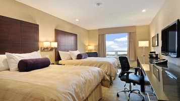 Premium bedding, desk, laptop workspace, blackout drapes