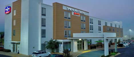 A Springhill Suites Marriott hotel with a modern design, a covered entrance, and a parking lot.