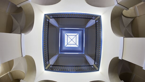 A spiral staircase with a central skylight. - Grand Hotel Capodimonte (Naples)