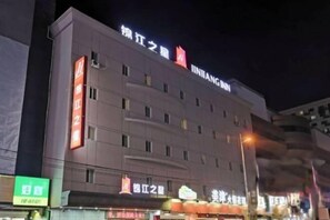 A multi-story hotel with signage indicating 'JINJANG Hotel' and 'JINJANG Hotel' in Chinese characters. - Jinjiang Inn (Shenyang Middle Street Metro Station, Imperial Palace) (Shenyang)