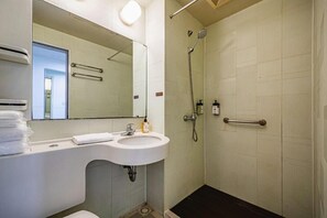 A bathroom with a sink, mirror, and shower. - Jinjiang Inn Chongqing Shopping & Entertainment (Chongqing)