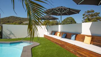Outdoor pool, a heated pool, sun loungers