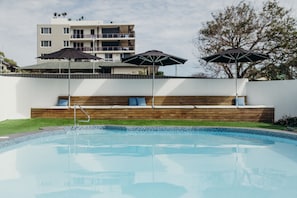 Outdoor pool, a heated pool, pool loungers