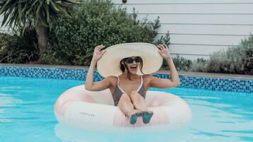 Outdoor pool, a heated pool, pool loungers