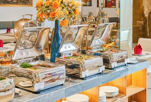 A buffet setup with multiple self-service chafing dishes labeled with food types. - Sky Gem Hotel - Ben Thanh (Ho Chi Minh City)