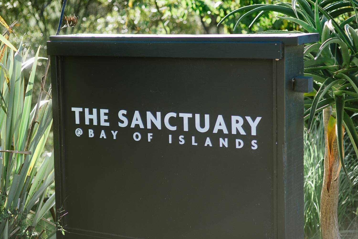 A sign for The Sanctuary Bay of Islands.