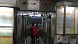 An elevator interior with a sign reading "MIRADOR MANSION". - Venetian Hostel (Kowloon)