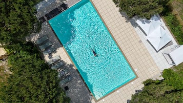 Seasonal outdoor pool, open 10:00 AM to 8:30 PM, pool umbrellas