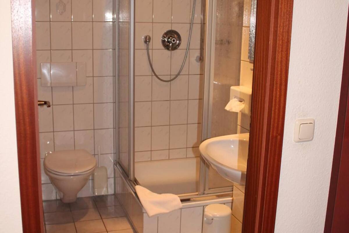 shower, hair dryer, bathrobes, slippers