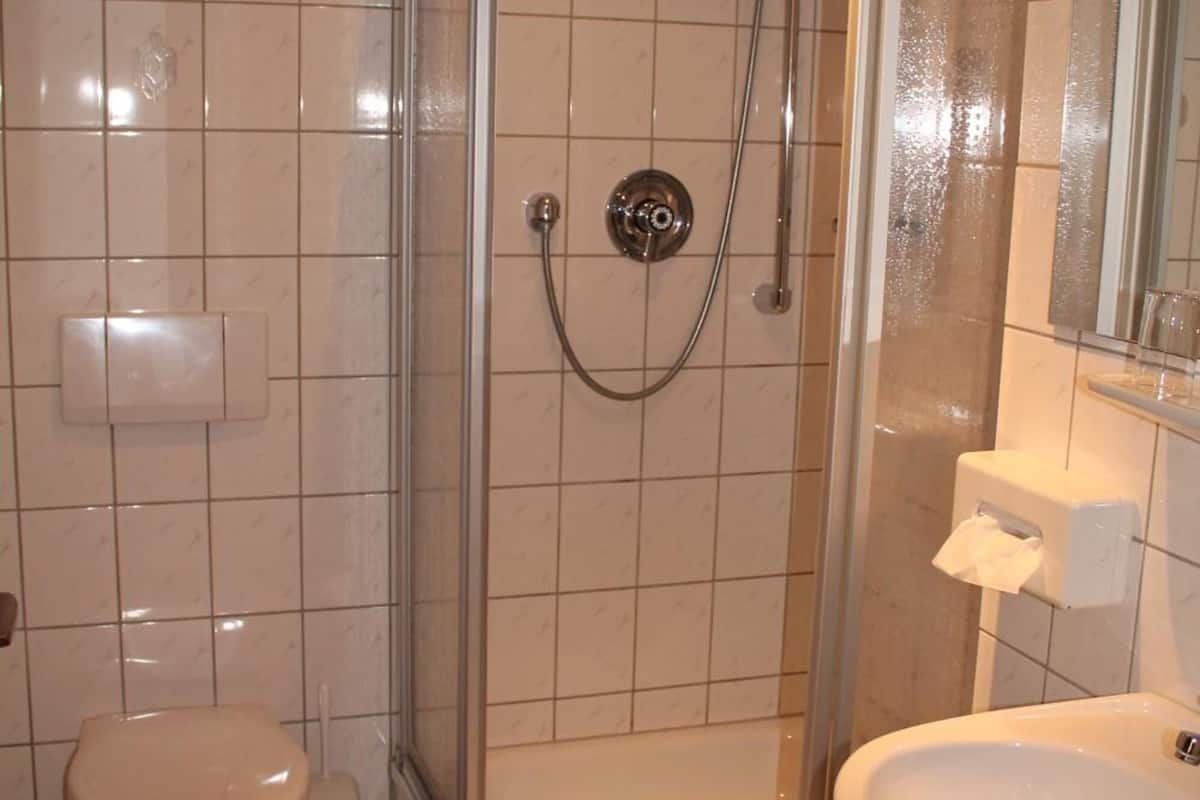 shower, hair dryer, bathrobes, slippers