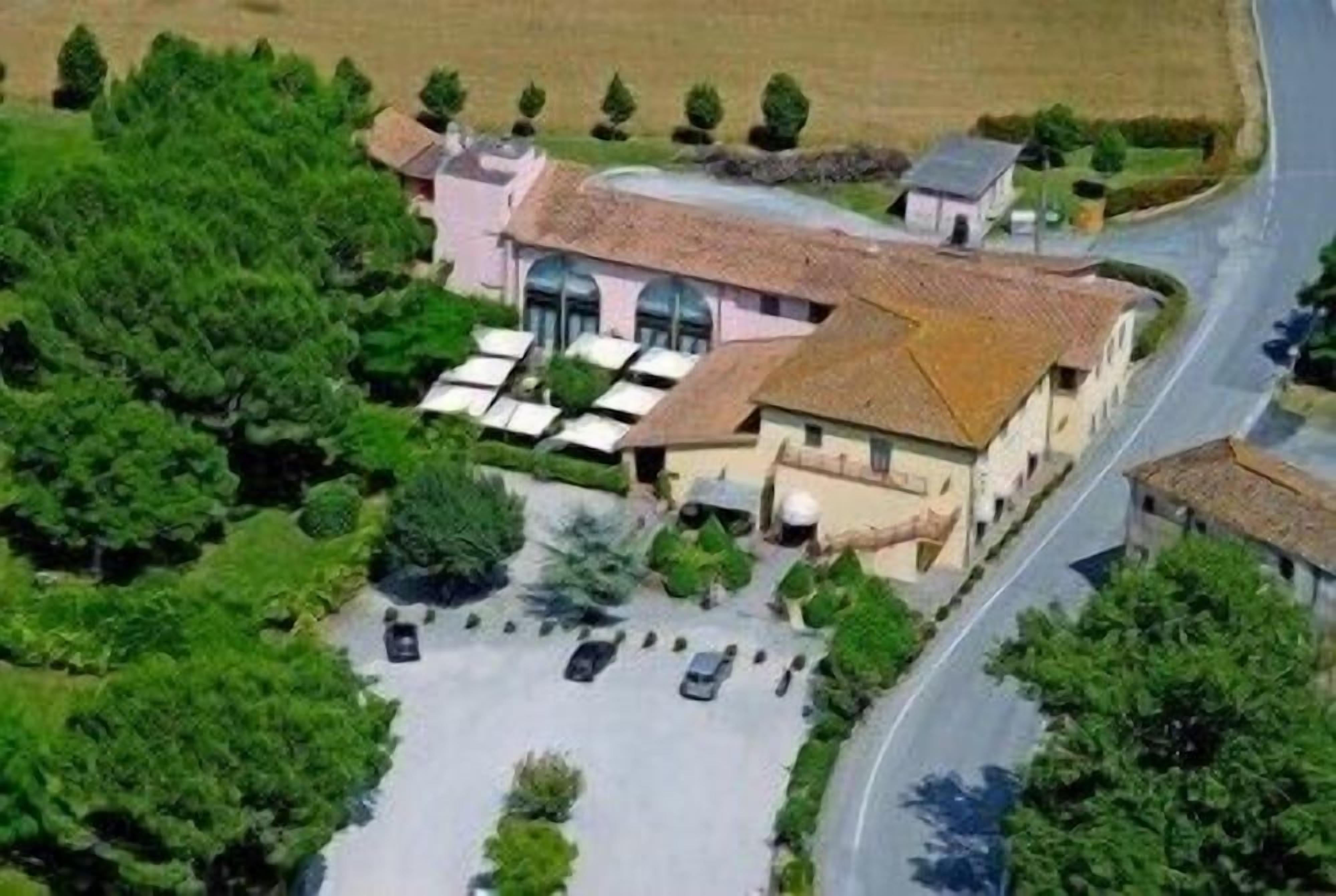A building with a parking lot and a road.