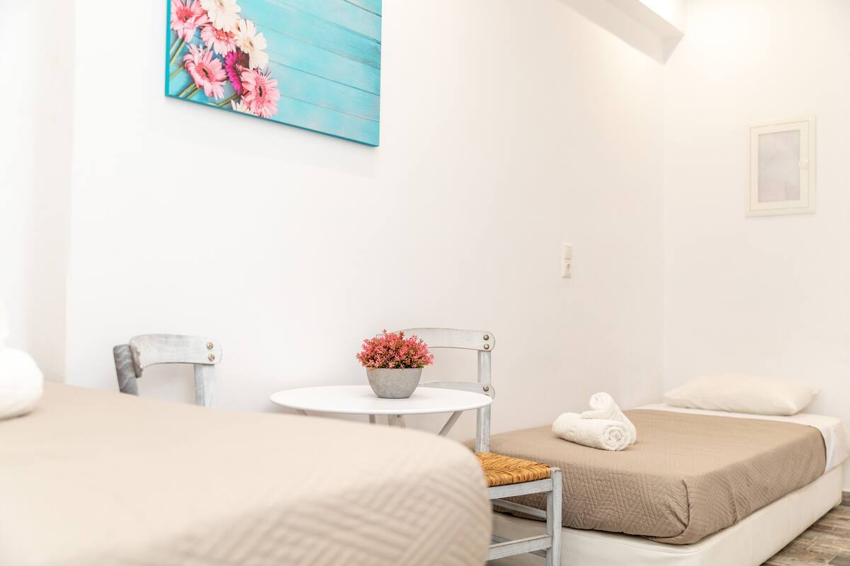 Premium bedding, desk, laptop workspace, blackout drapes