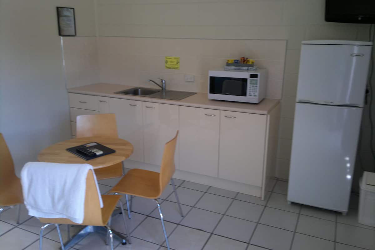 economy quadruple room | private kitchenette | full-sized fridge, microwave, coffee/tea maker, electric kettle