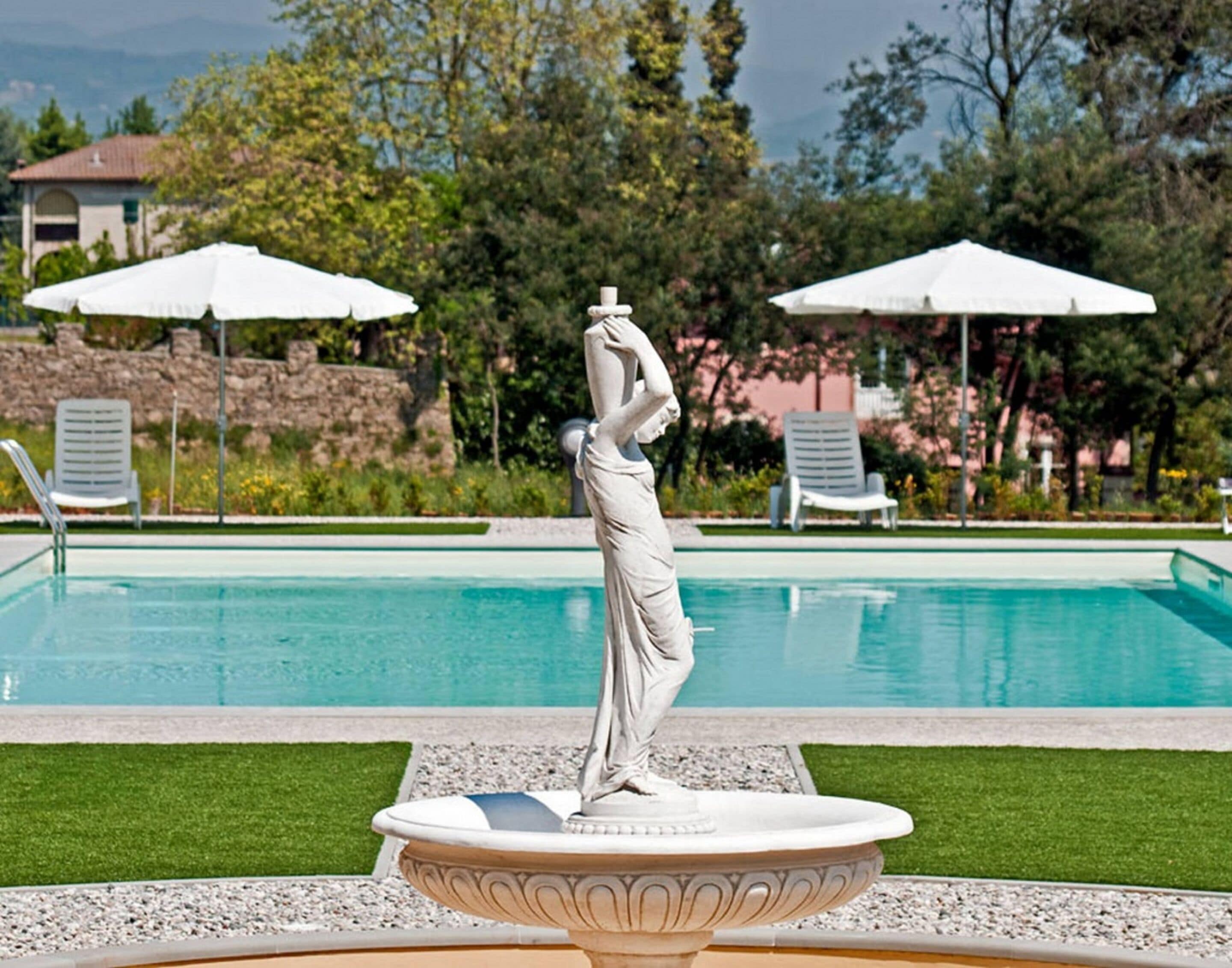 seasonal outdoor pool, pool umbrellas, pool loungers