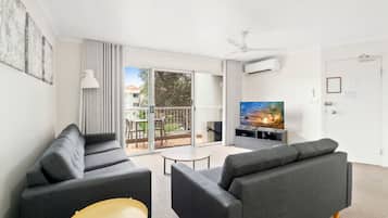Budget Friendly Two-Bedroom Apartment | Living area | 45-inch Smart TV with digital channels, TV
