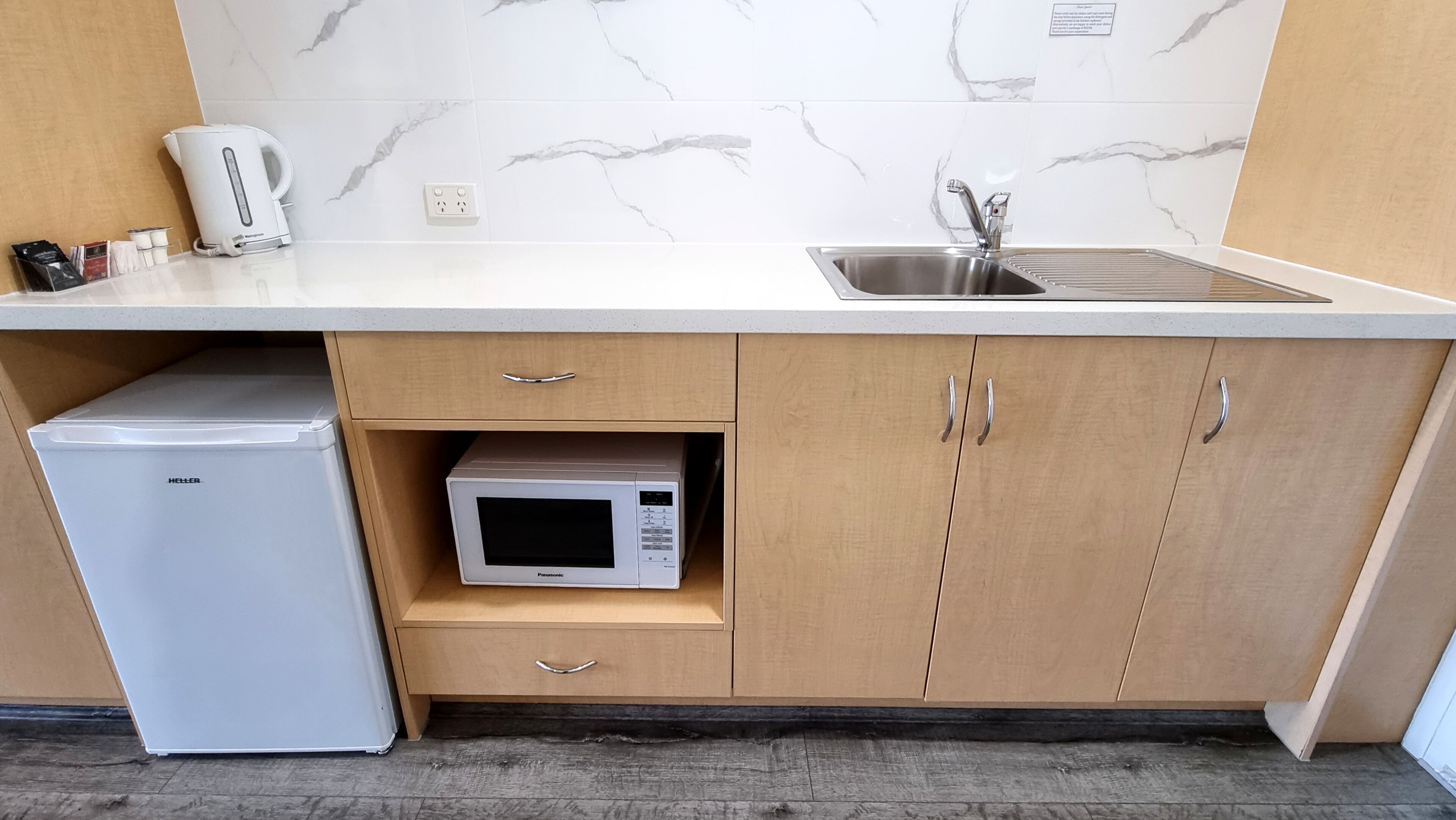 microwave, electric kettle, toaster, cleaning supplies