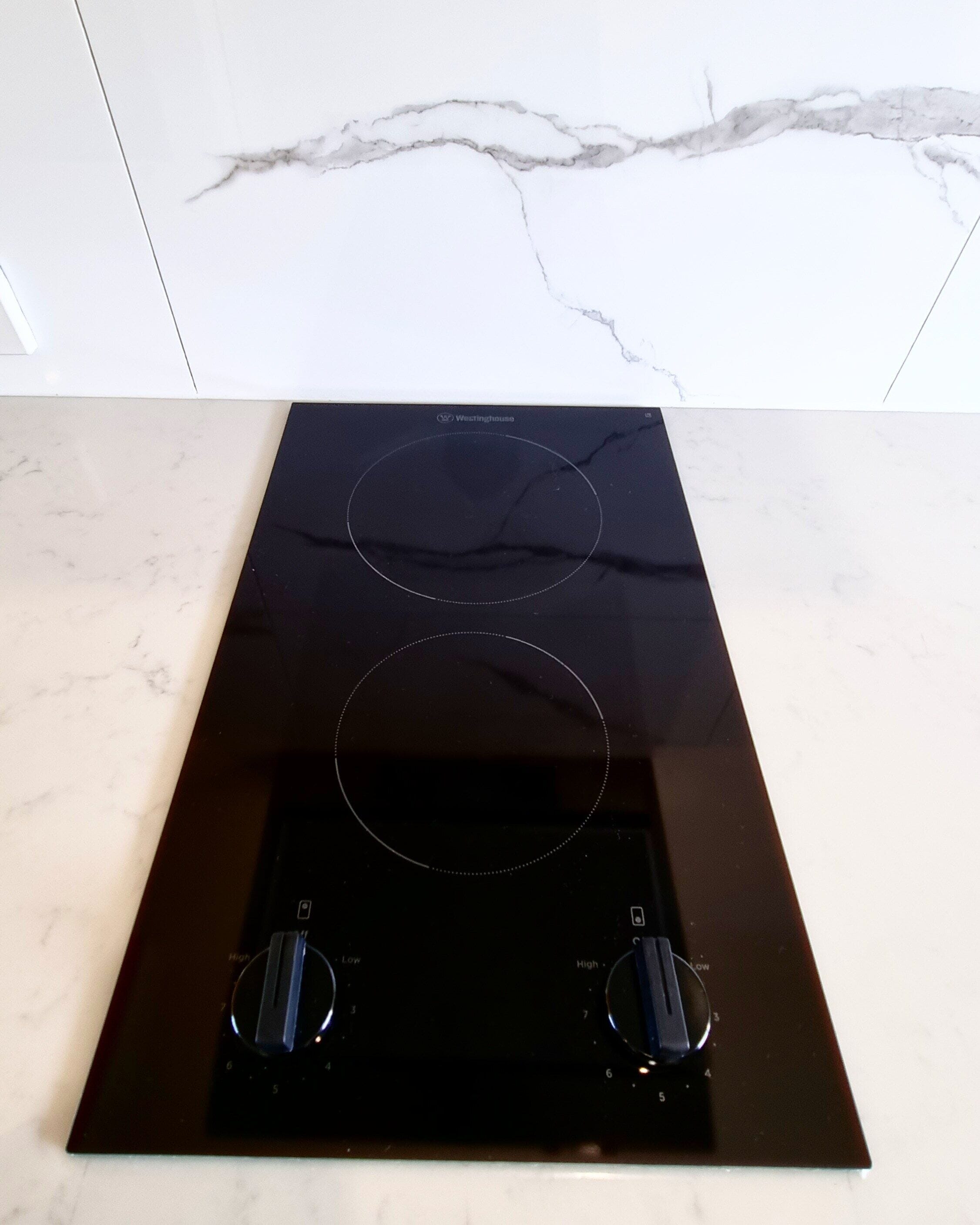 microwave, electric kettle, toaster, cleaning supplies