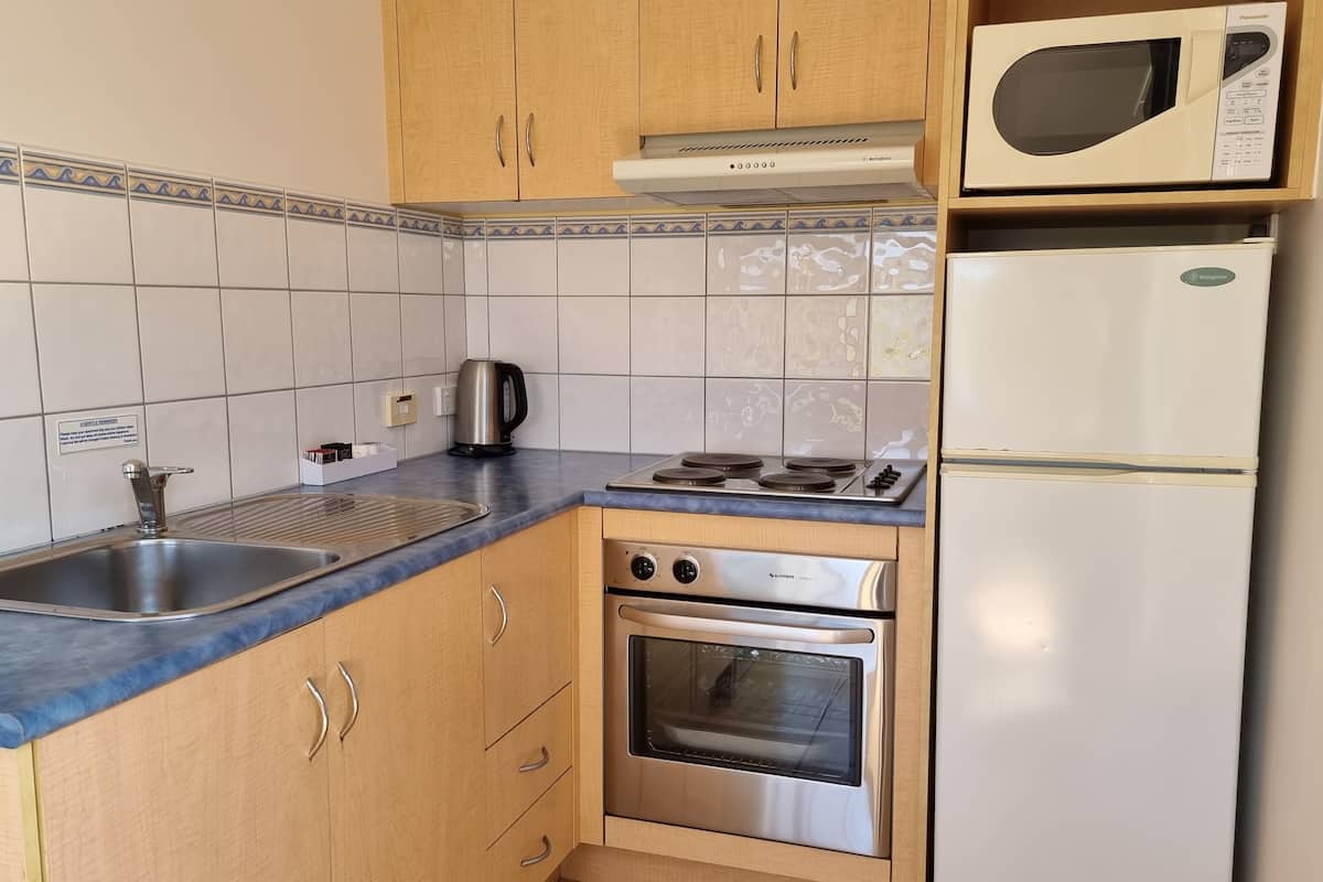 one bedroom apartment | private kitchen | microwave, electric kettle, toaster, cleaning supplies