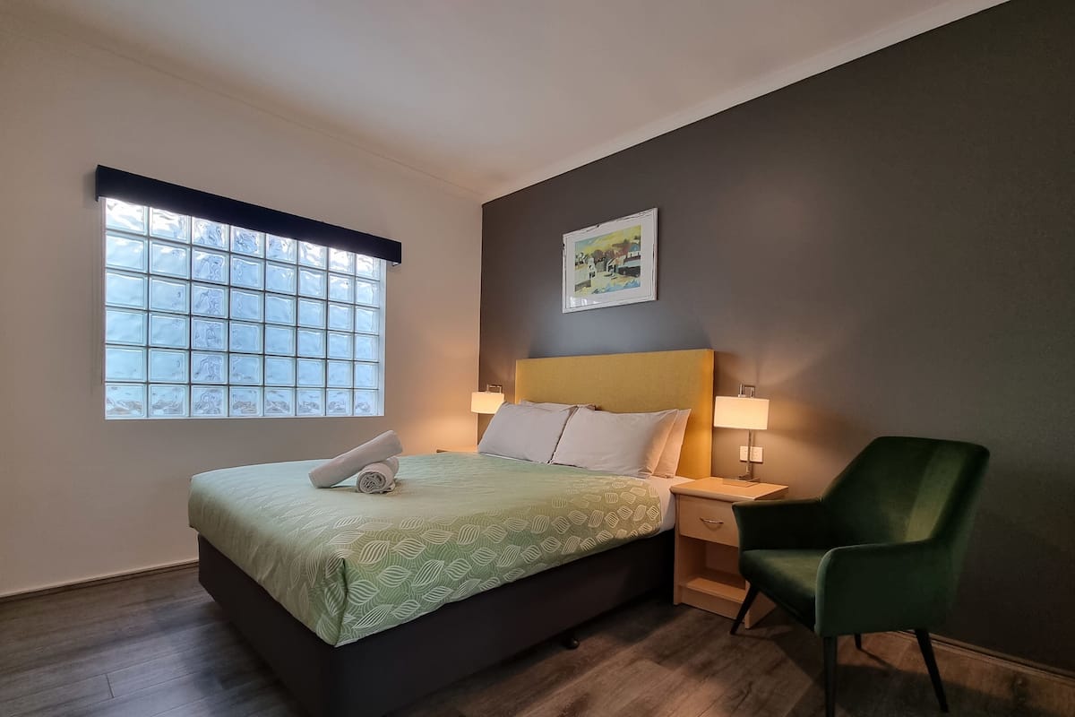 1 bedroom, desk, blackout drapes, iron/ironing board