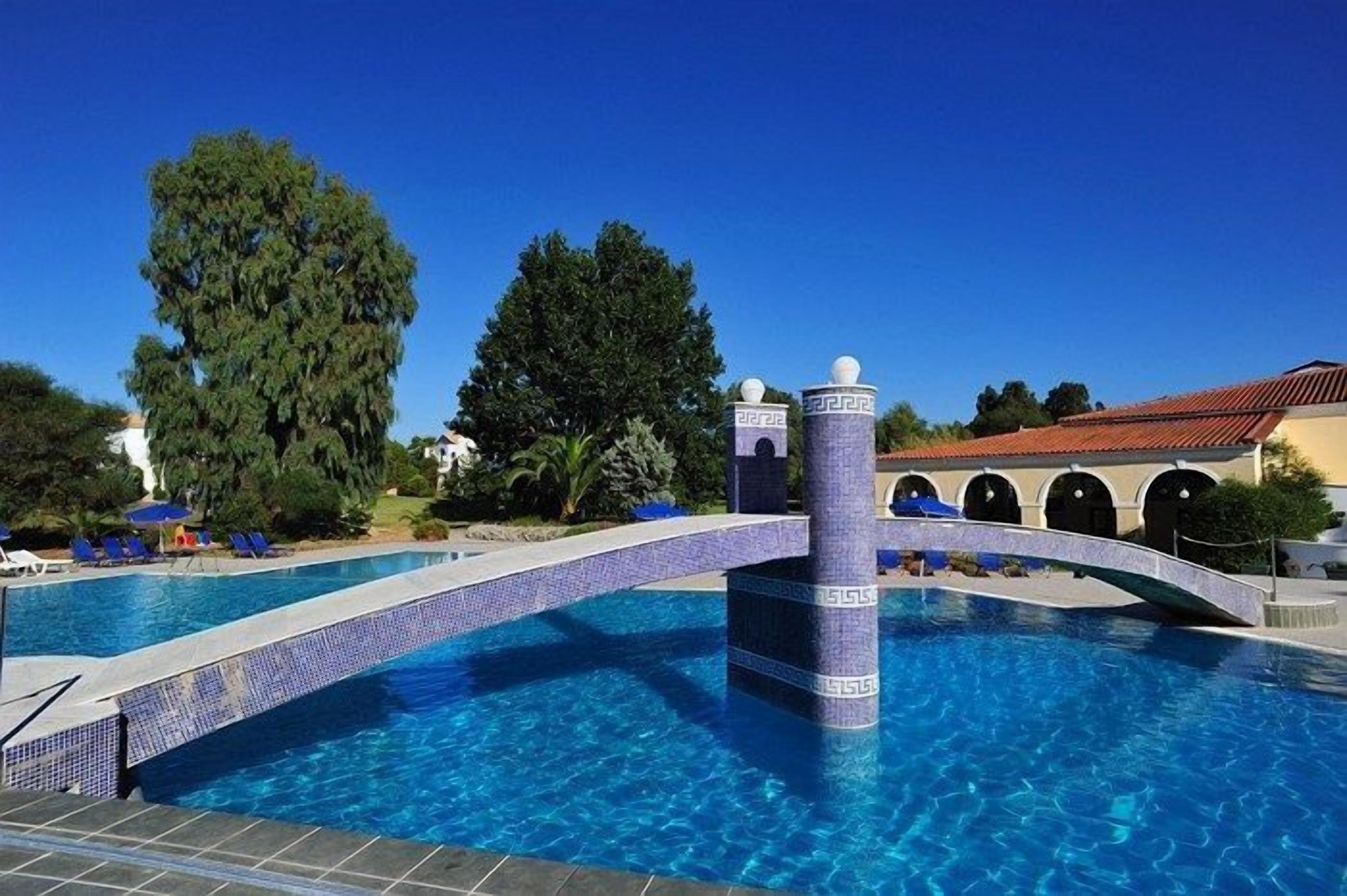 outdoor pool, pool umbrellas, pool loungers