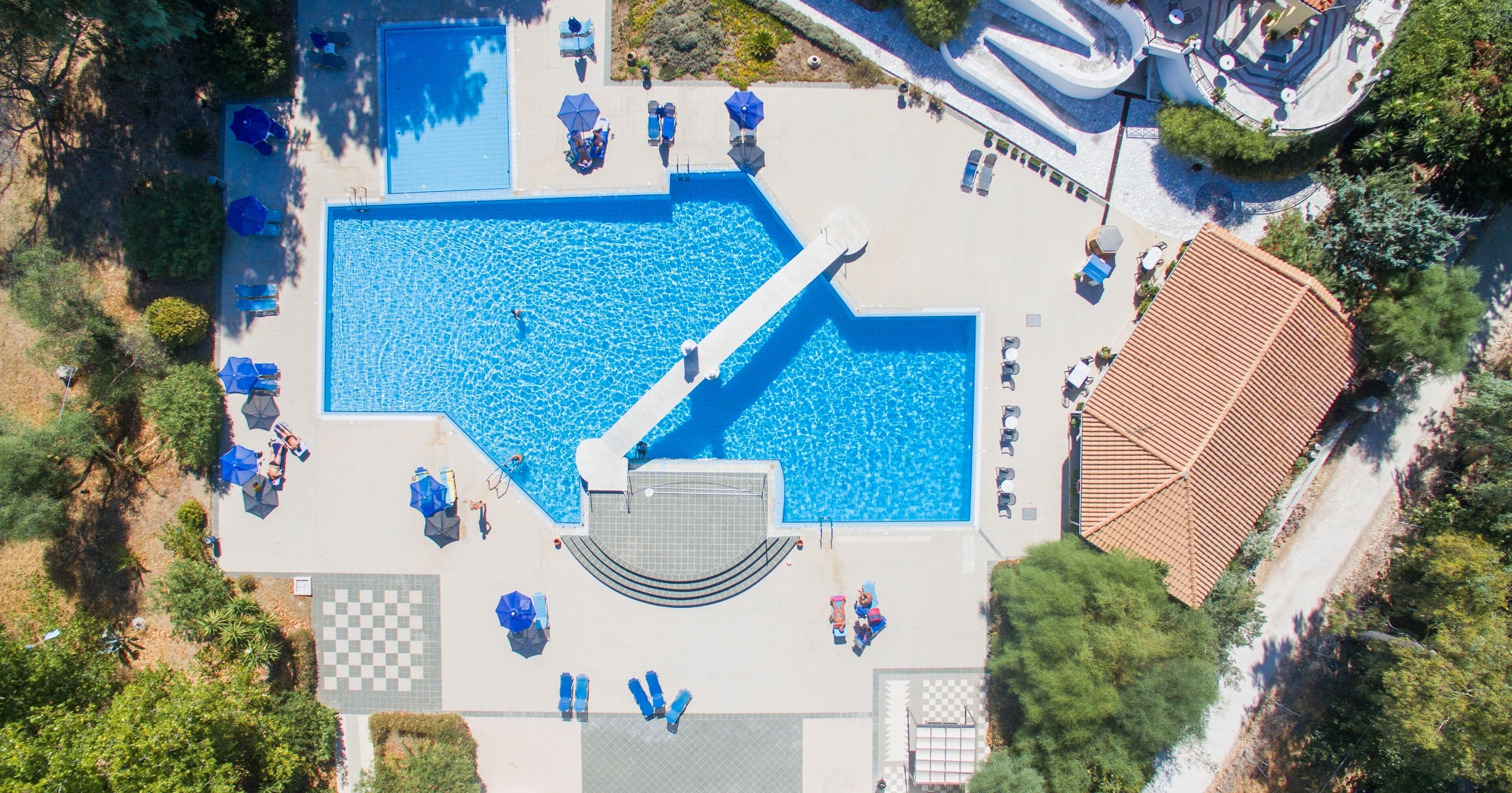 outdoor pool, pool umbrellas, pool loungers