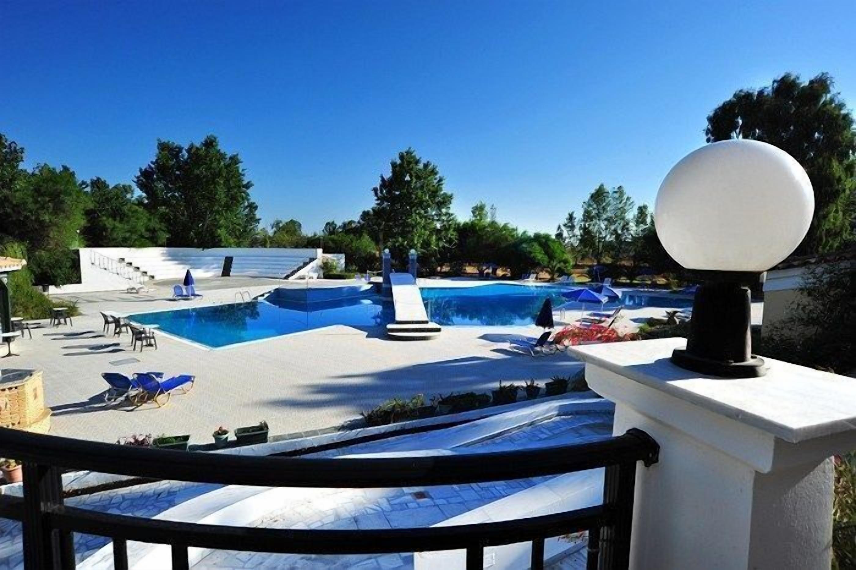 outdoor pool, pool umbrellas, pool loungers