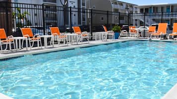 Seasonal outdoor pool, open 8:00 AM to 8:00 PM, pool loungers