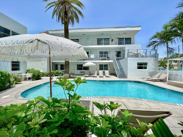 2 outdoor pools, pool umbrellas, pool loungers