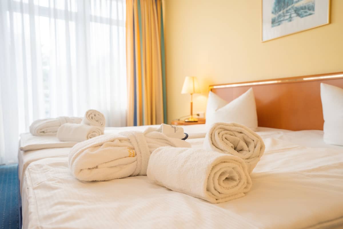 comfort double room, city view (land view) | bathroom | free toiletries, hair dryer, bathrobes, towels