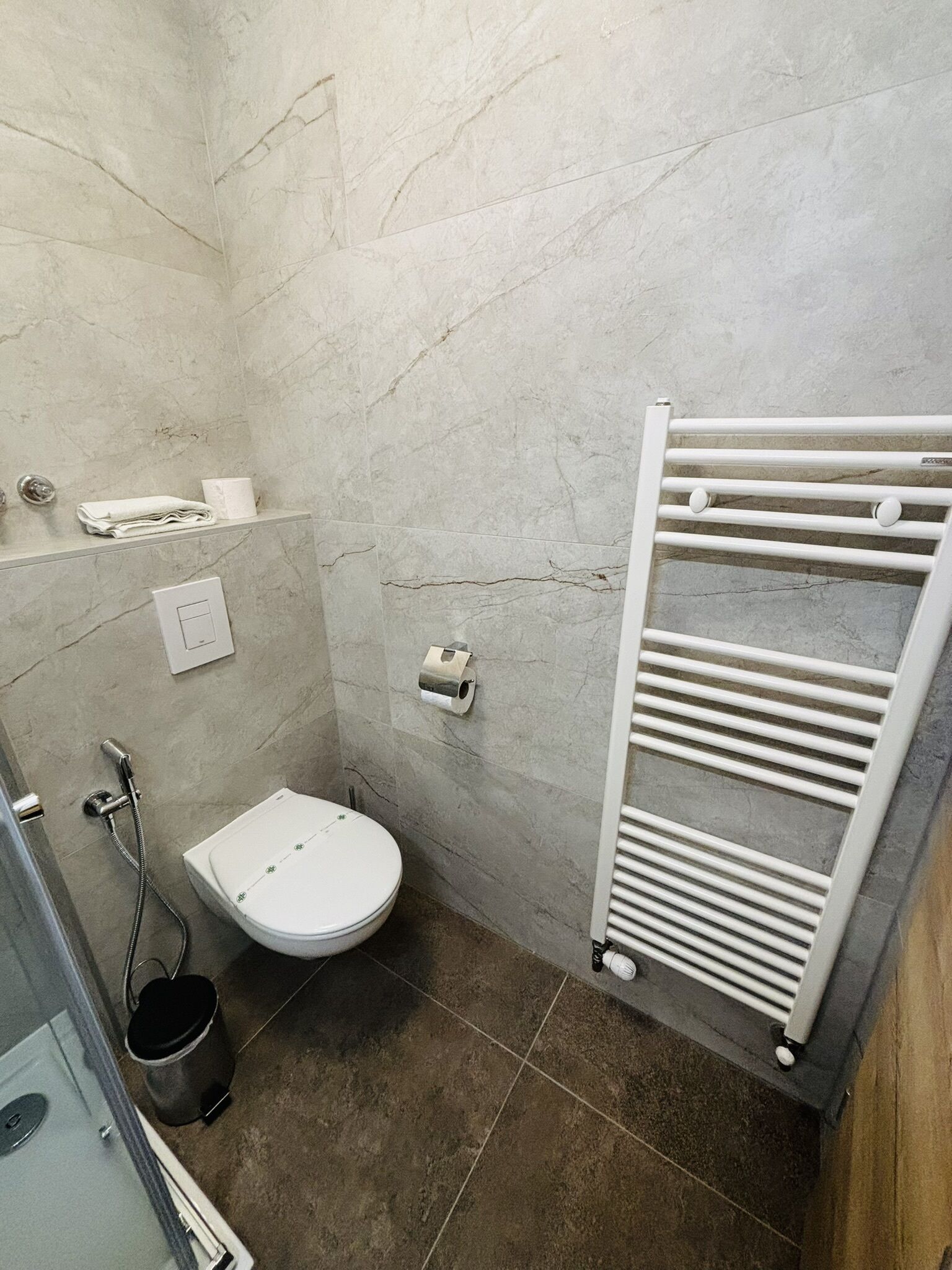 shower, hair dryer, slippers, towels