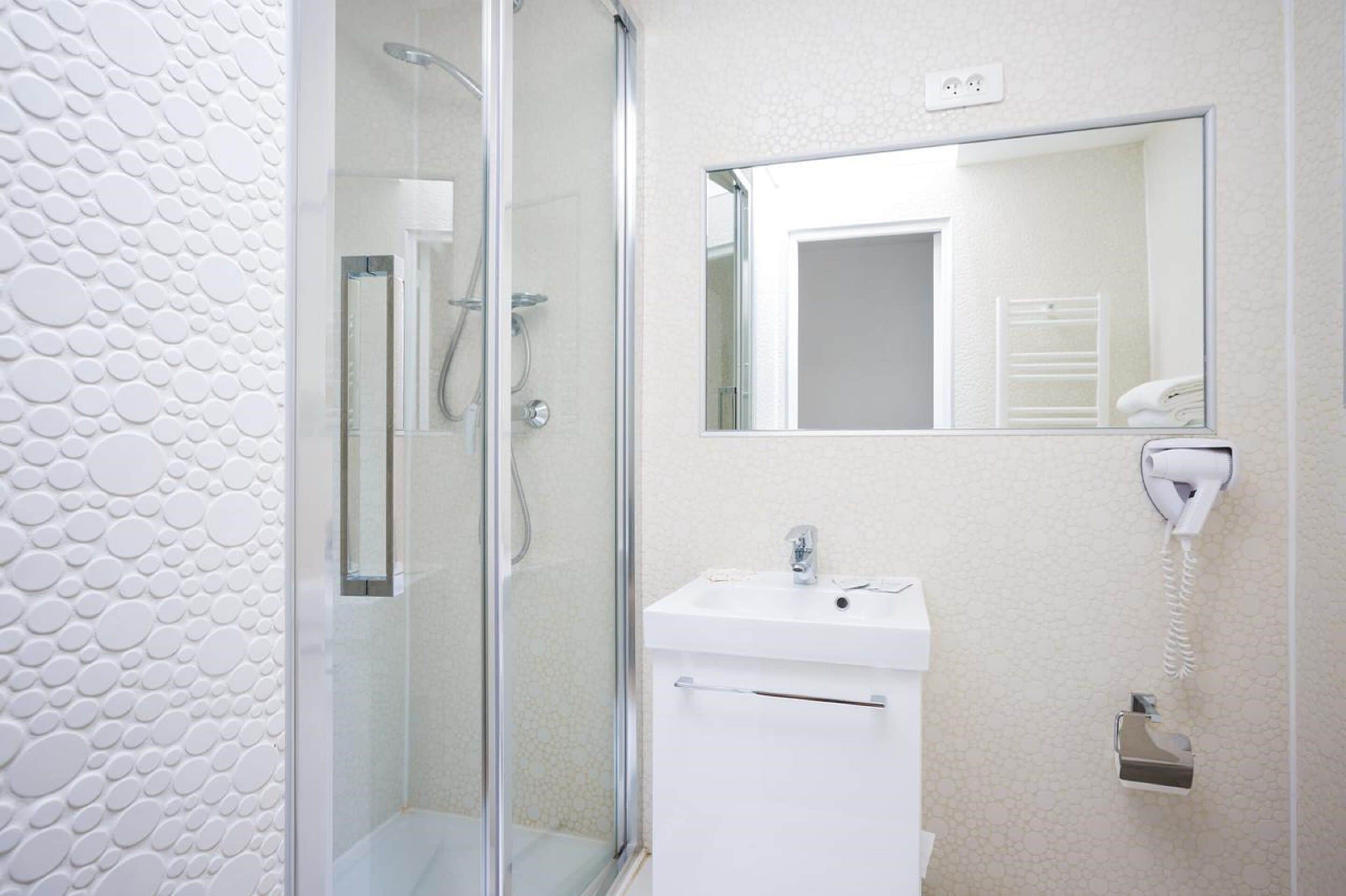 twin room | bathroom | shower, hair dryer, towels, shampoo