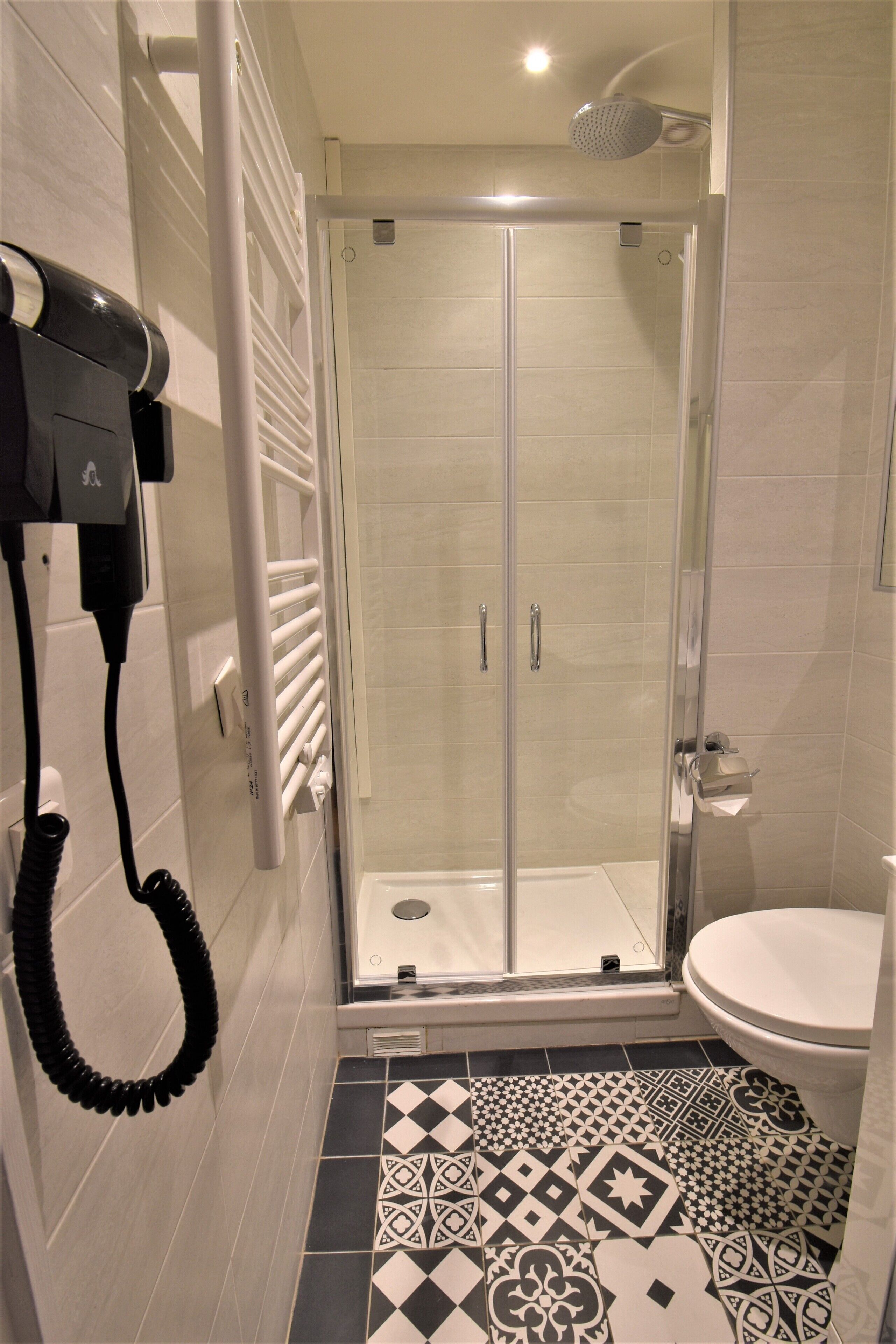 superior double or twin room | bathroom | shower, hair dryer, towels, shampoo