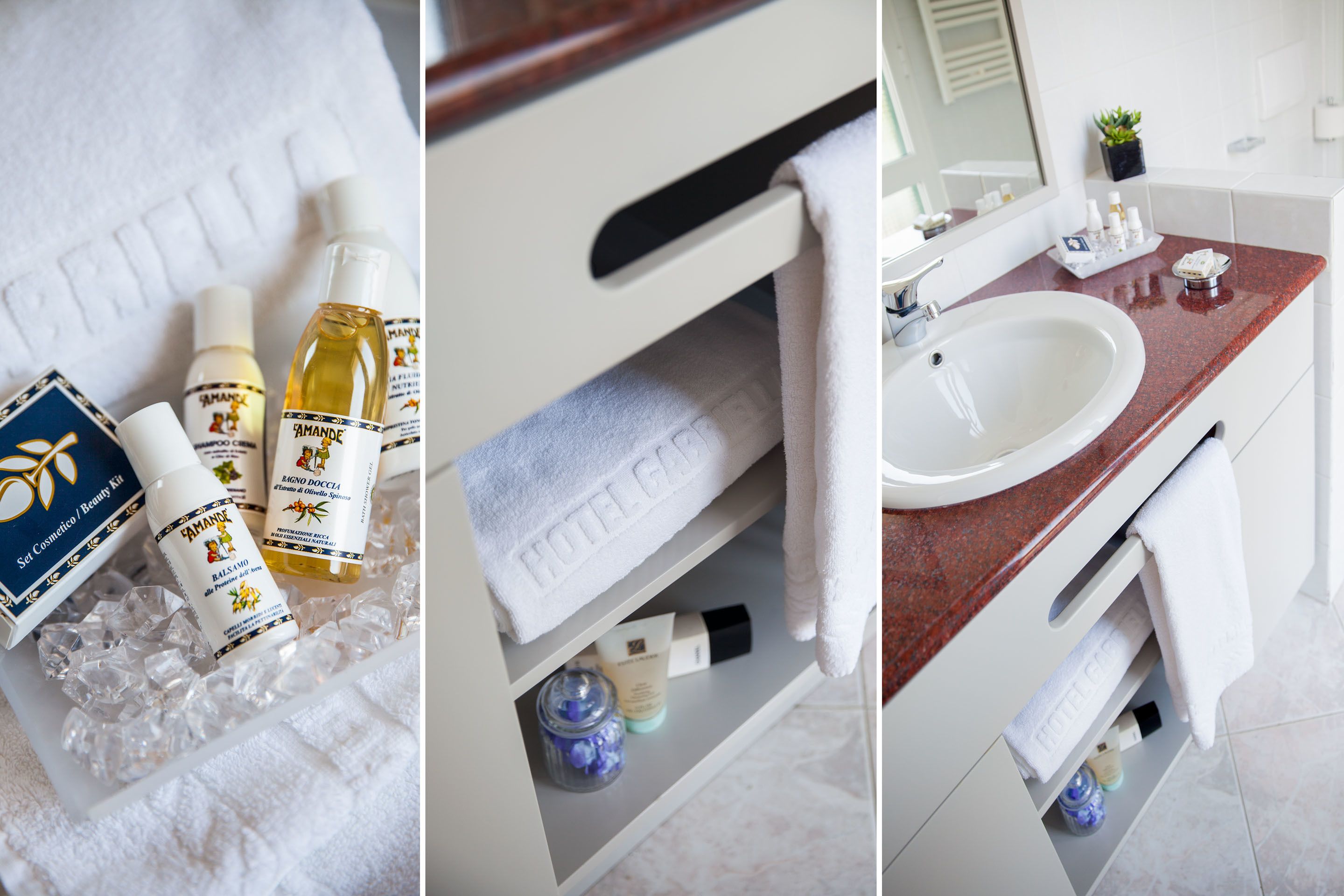 A bathroom with a white sink, a mirror, and toiletries on the counter.