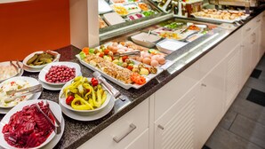 A buffet with various dishes including pasta, eggs, and salads. - Royal Park Boutique Hotel (Budapest)